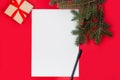 Letter to Santa Claus. Christmas and New Year holiday card with empty paper sheet on red background Royalty Free Stock Photo