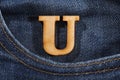 Letter U of the alphabet - blue jeans texture background. Top view Royalty Free Stock Photo