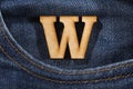 Letter W of the alphabet - blue jeans texture background. Top view Royalty Free Stock Photo