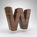 Letter W uppercase on white background. Dark oak 3D letter with brown wood texture. Royalty Free Stock Photo