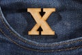 Letter X of the alphabet - blue jeans texture background. Top view Royalty Free Stock Photo