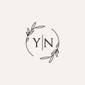 Letter YN wedding monogram logo design with simple natural circle leaf frame Royalty Free Stock Photo