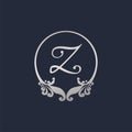 Letter Z Decorative Crown Ring Alphabet Logo isolated on Navy Blue Background. Luxury Silver Initial Abjad Logo Design Template.