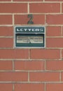 Letterbox in brick wall