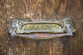 Letterbox detail in an ancient wooden door Royalty Free Stock Photo