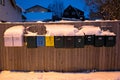 Letterboxes in front of a home in winter