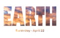 Lettering Earth Day April 22 on the background of sunset sky. Earth day concept, protection of the planet from pollution,