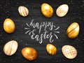 Lettering Happy Easter with Golden Eggs on Black Chalkboard Background Royalty Free Stock Photo