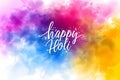 Lettering Holi on colorful abstract background. Colorful powder explosion, gulal powder. Festival of Colors Royalty Free Stock Photo