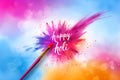 Lettering Holi on colorful abstract background. Colorful powder explosion, gulal powder. Festival of Colors Royalty Free Stock Photo