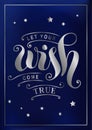 Lettering of Let your wish come true in silver with decorative elements and stars on dark blue background