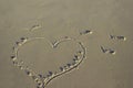 Lettering love, heart on sand sunrise background sea, beach dawn wave