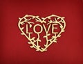 Lettering love in wooden heart on red paper background for holday card