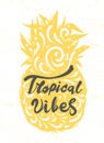 Lettering quote `Tropical vibes`. Calligraphy hand drawn vector illustration silhouette of pineapple. Colorful design for t-shirt
