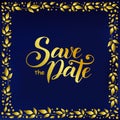 Lettering of Save the date in golden gradient on blue velvet background decorated with frame of golden leaves Royalty Free Stock Photo