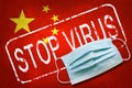 Lettering stamp Stop Virus and medical mask on China flag. Return of the coronavirus. New jump in incidence. Strain Omicron and