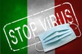 Lettering stamp Stop Virus and medical mask on Italy flag. Return of the coronavirus. New jump in incidence. Strain Omicron and