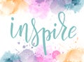 Lettering on watercolored background. Inspire. Royalty Free Stock Photo