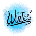 Lettering Winter written by hand with blue watercolor splashes. Calligraphic inscription. Royalty Free Stock Photo