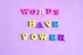 lettering Words have power on a pink background composed of multicolored wooden letters in the abc alphabet block, copy space for Royalty Free Stock Photo