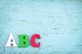 Letters ABC on light blue wooden background Royalty Free Stock Photo