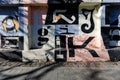 Letters drawn on concrete fence. Background with creatively designed letters.