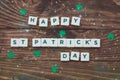Letters Happy St.Patrick`s Day on wooden background, greeting card Royalty Free Stock Photo