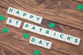 Letters Happy St.Patrick`s Day on wooden background, greeting card Royalty Free Stock Photo