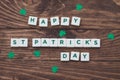 Letters Happy St.Patrick`s Day on wooden background, greeting card Royalty Free Stock Photo