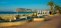 Letters of the name of the city of Alanya and a fountain with a sculpture of apricot fruit. Landscape with a view of the city. Royalty Free Stock Photo