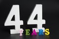 Letters and numbers forty-four years on a black background. Royalty Free Stock Photo