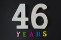 Letters and numbers forty-six years on a black background. Royalty Free Stock Photo