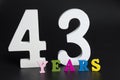Letters and numbers forty-three years on a black background. Royalty Free Stock Photo