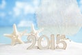 2015 letters with starfish, ocean ,white sand beach Royalty Free Stock Photo