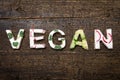 Letters of vegetable canapes builds the word Vegan Royalty Free Stock Photo