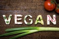 Letters of vegetable canapes builds the word Vegan Royalty Free Stock Photo