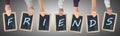 Letters of the word friends written on chalkboards