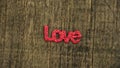 Letters word `LOVE` on wooden table