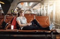 Letting everyone know Im safe at the airport. Full length shot of an attractive young woman using a cellphone in an Royalty Free Stock Photo