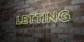 LETTING - Glowing Neon Sign on stonework wall - 3D rendered royalty free stock illustration