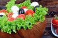 Lettuce salad mozzarella tomato in a bowl on table Royalty Free Stock Photo