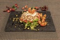 lettuce salad, roasted red piquillo peppers with onion and split cherry tomatoes with preserved tuna belly