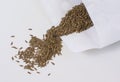 Lettuce seeds being poured from a packet