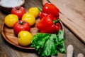 lettuce, yellow and red tomatoes and bell pepper with water drops. cucumbers. Royalty Free Stock Photo