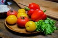 lettuce, yellow and red tomatoes and bell pepper with water drops. cucumbers. Royalty Free Stock Photo