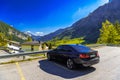 LEUKERBAD, SWITZERLAND - APR 2017: Black BMW 3 3er F30 in swiss village in Alps, Leukerbad, Leuk, Visp, Wallis, Valais Switzerland