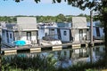 Pier at dutch inland lake harbor marina with houseboats for rent on water