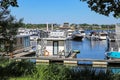 Pier at dutch inland lake harbor marina with houseboats for rent on water