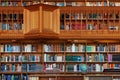 LEUVEN, BELGIUM - SEPTEMBER 05, 2014: Wooden bookshelves in the historical library of the Catholic University in Leuven. Royalty Free Stock Photo