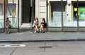 Leuven, Flemish Brabant - Belgium - Two teenage girls eating fastfood at a bus stop